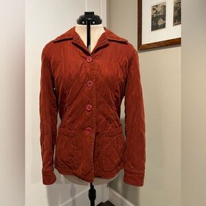 Rust colored women’s jacket. Faconnable.